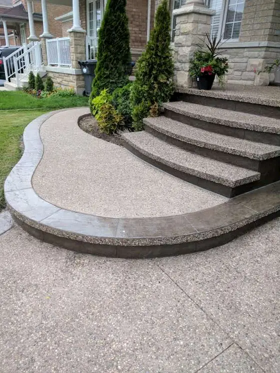 Curved exposed aggregate steps with a dark contrast border