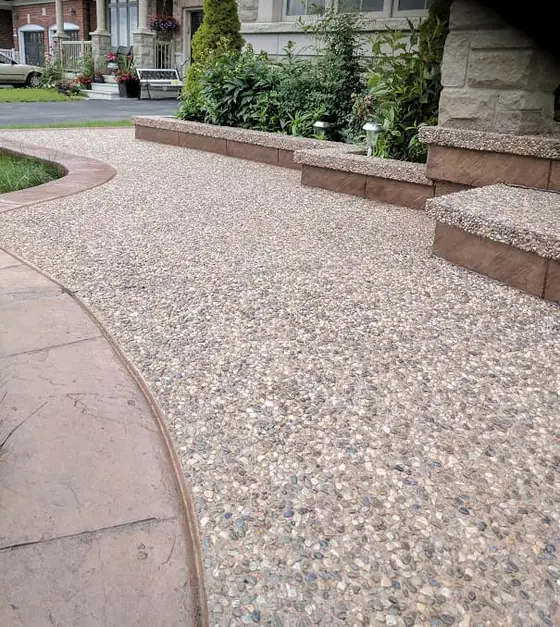 Exposed aggregate entrance with warm decorative borders