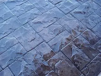 Blue-grey decorative stamped concrete with stone-look texture