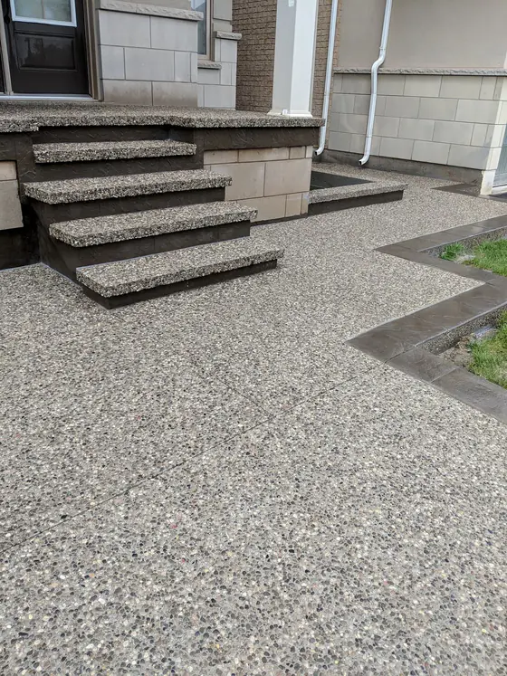 Exposed aggregate front steps with neat contrasting borders