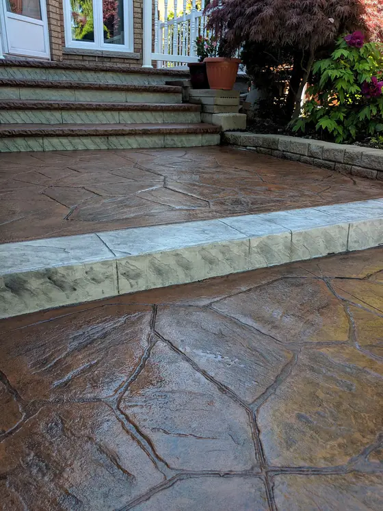 Glossy, freshly sealed brown stamped concrete patio