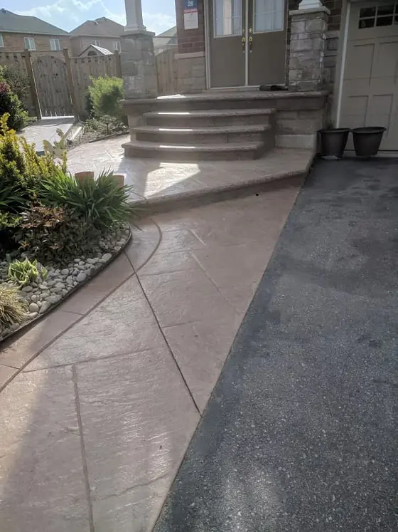 Stamped concrete walkway leading to front steps